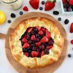 overhead view of Keto Mixed Berry Galette on wooden board