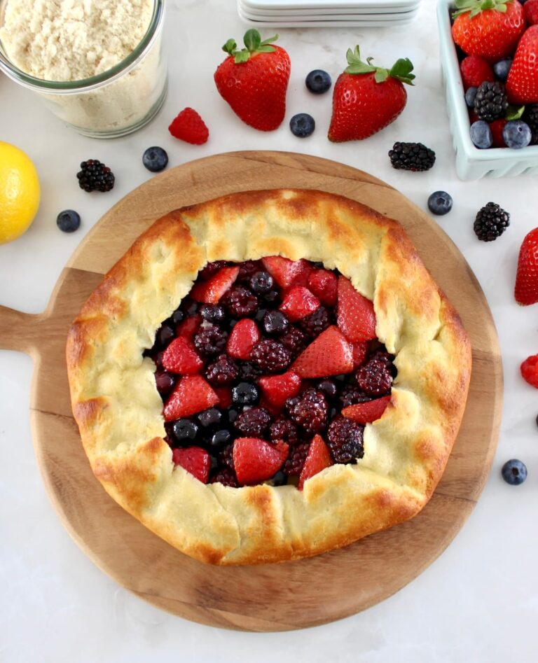 overhead view of Keto Mixed Berry Galette on wooden board