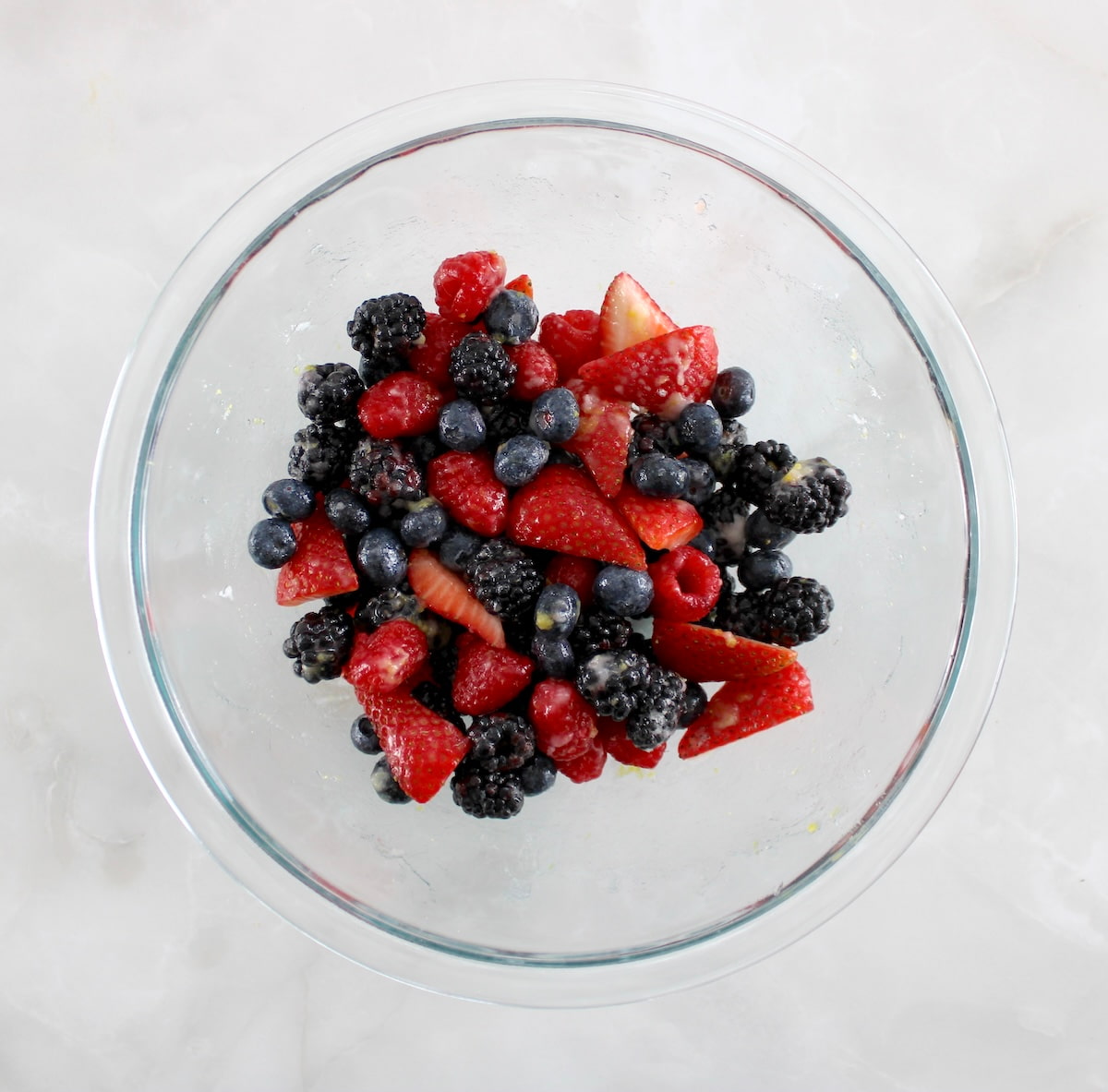 mixed frozen berries in glass bowl
