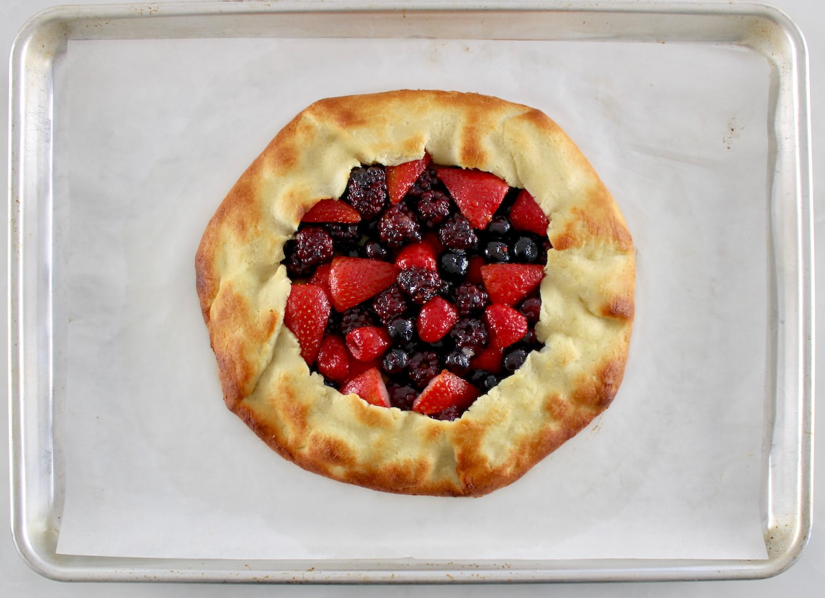 Keto Mixed Berry Galette on parchment lined baking sheet