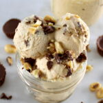 closeup of Peanut Butter Cup Mason Jar Ice Cream with chopped peanuts and chocolate