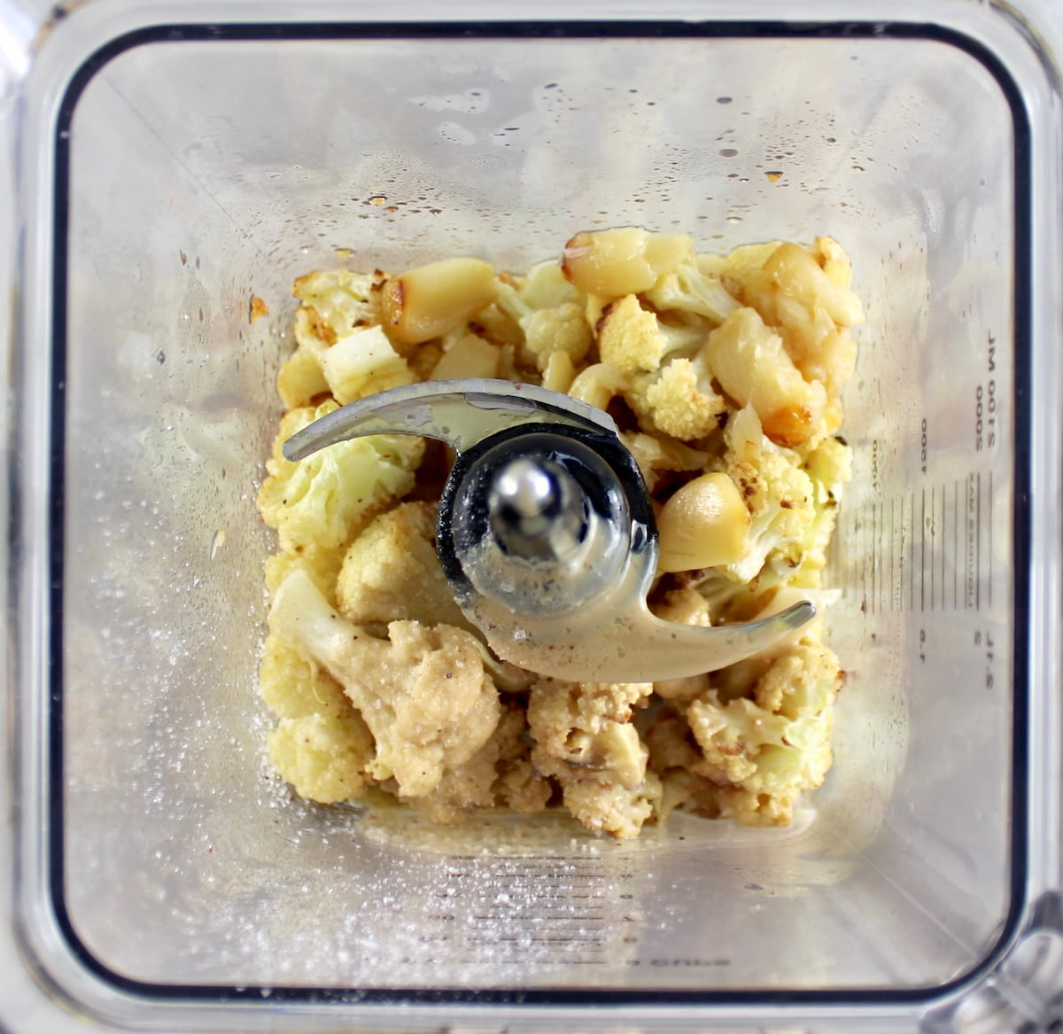 Roasted Garlic Cauliflower Hummus ingredients in blender unmixed