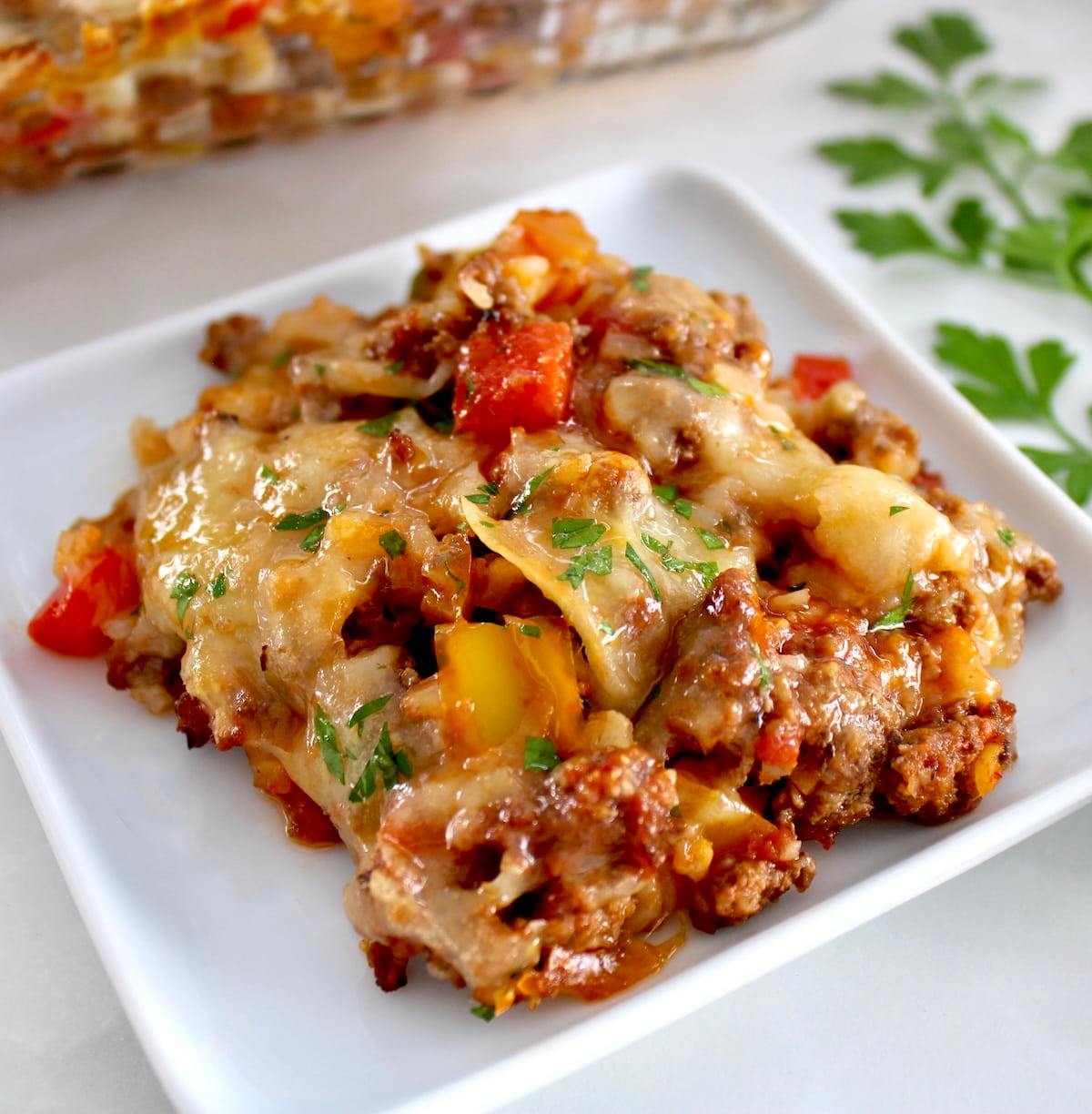 closeup of piece of Stuffed Pepper Casserole on white dish