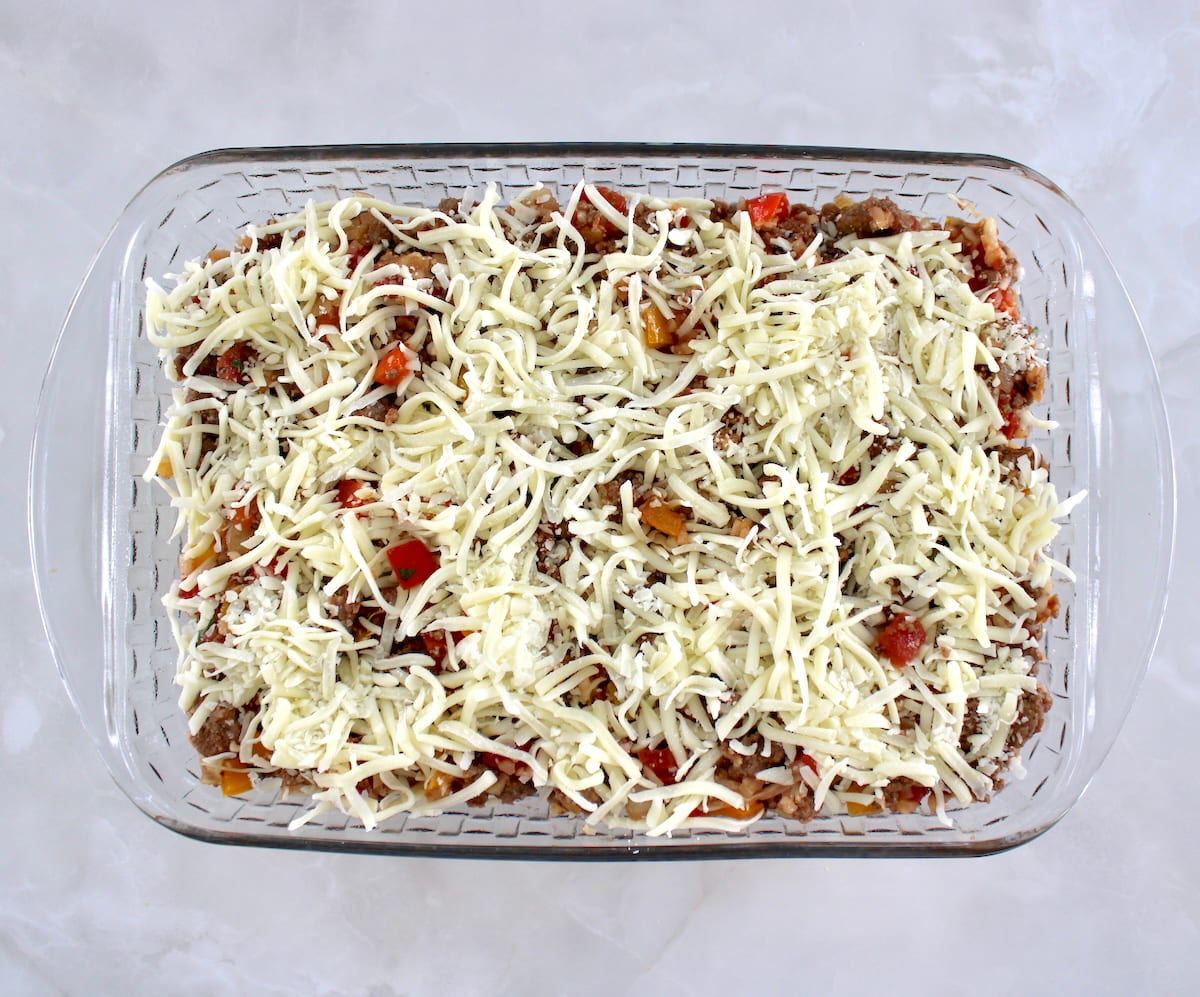 Stuffed Pepper Casserole with shredded cheese on top unbaked