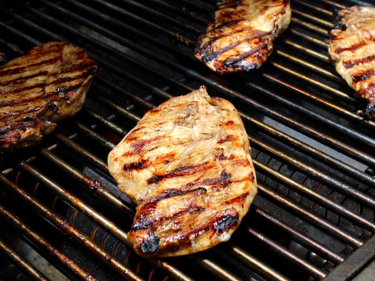 balsamic marinated chicken grilling on outdoor grill