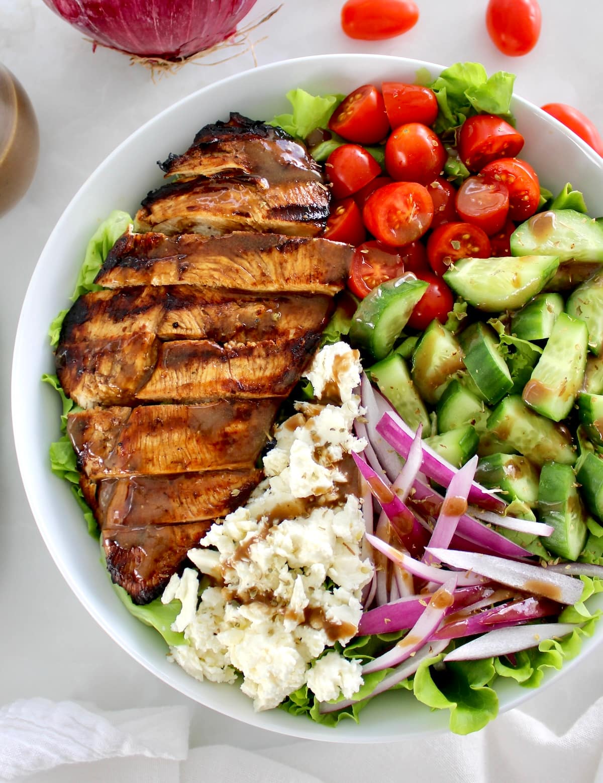 closeup overhead view of Balsamic Grilled Chicken Salad in white bowl
