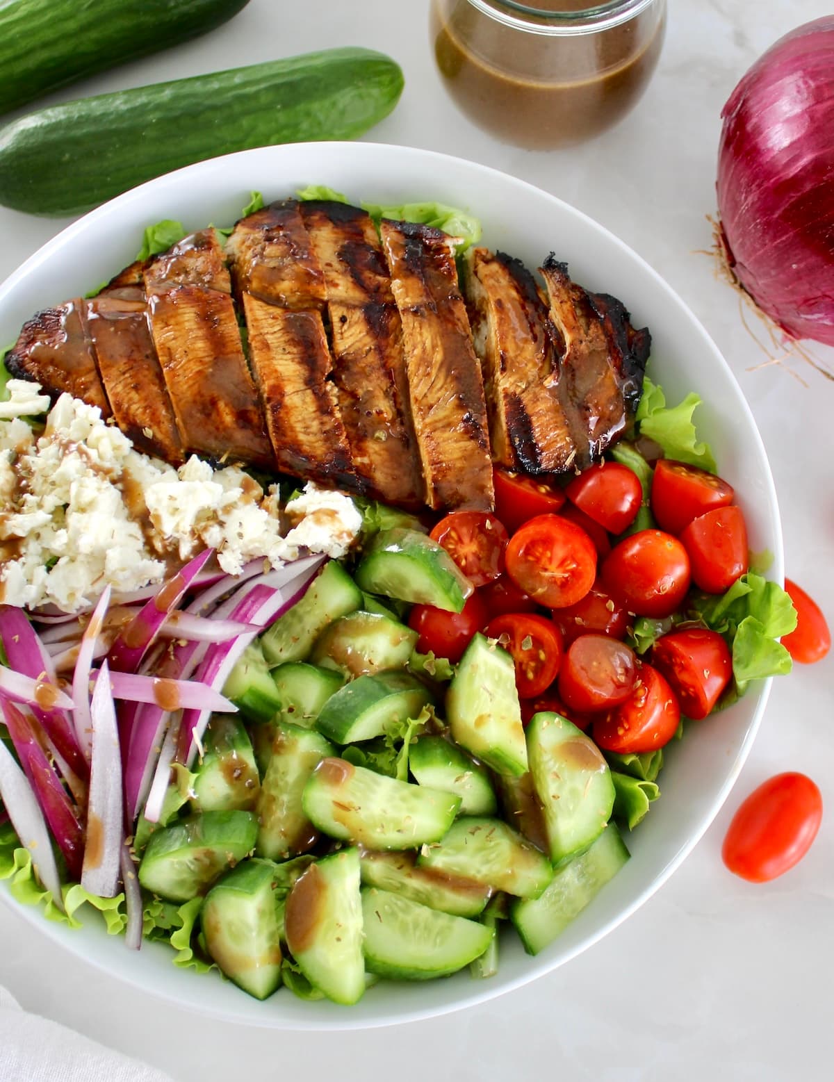closeup overhead view of Balsamic Grilled Chicken Salad in white bowl
