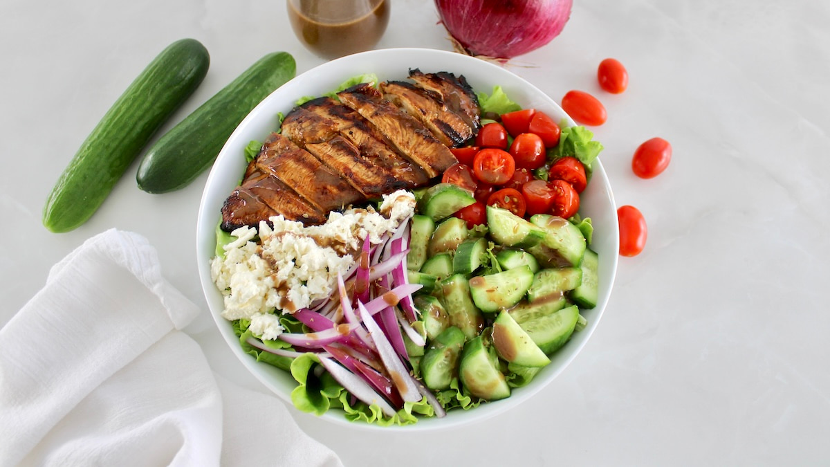 overhead view of Balsamic Grilled Chicken Salad in white bowl