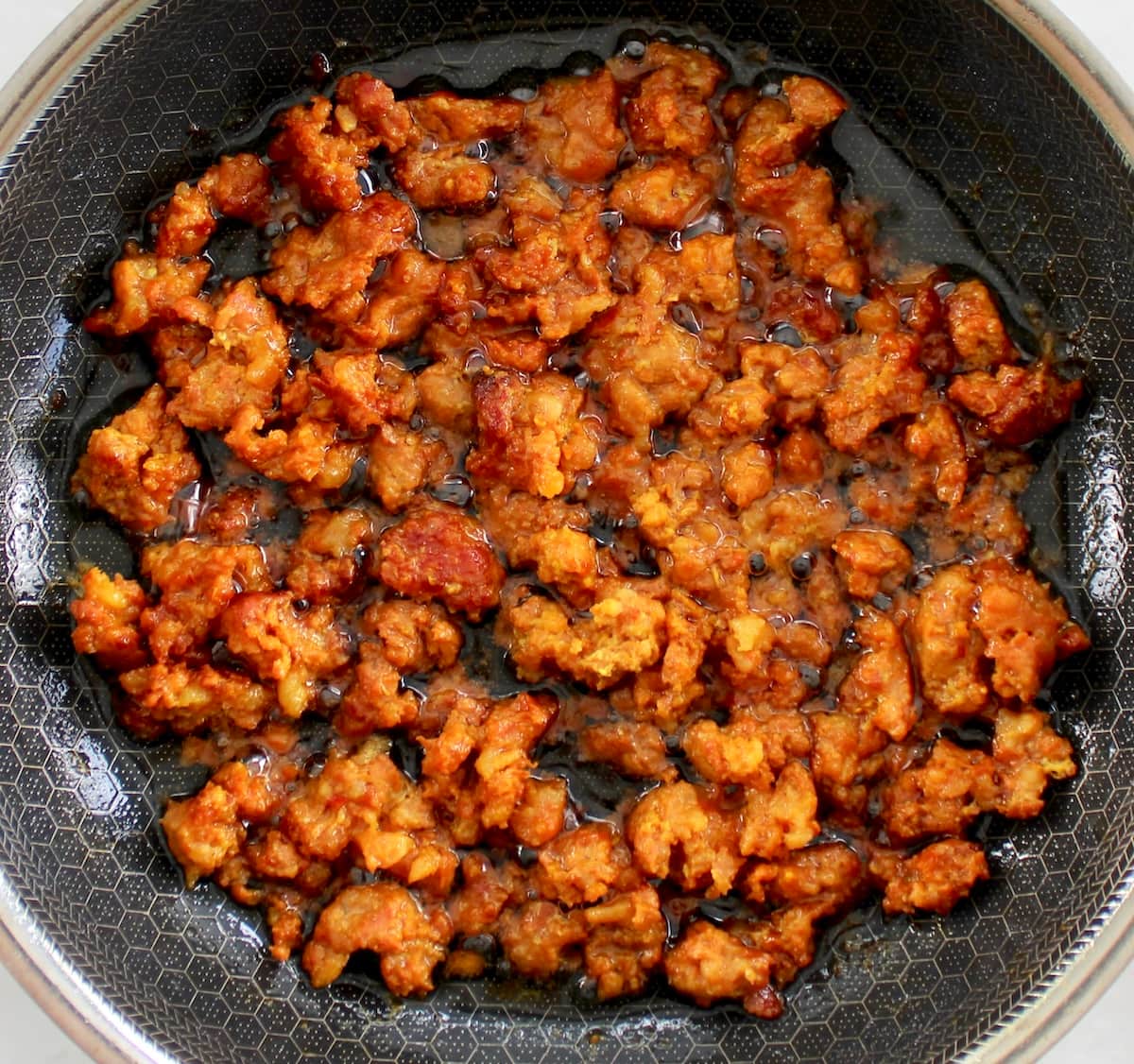 chorizo cooking in skillet