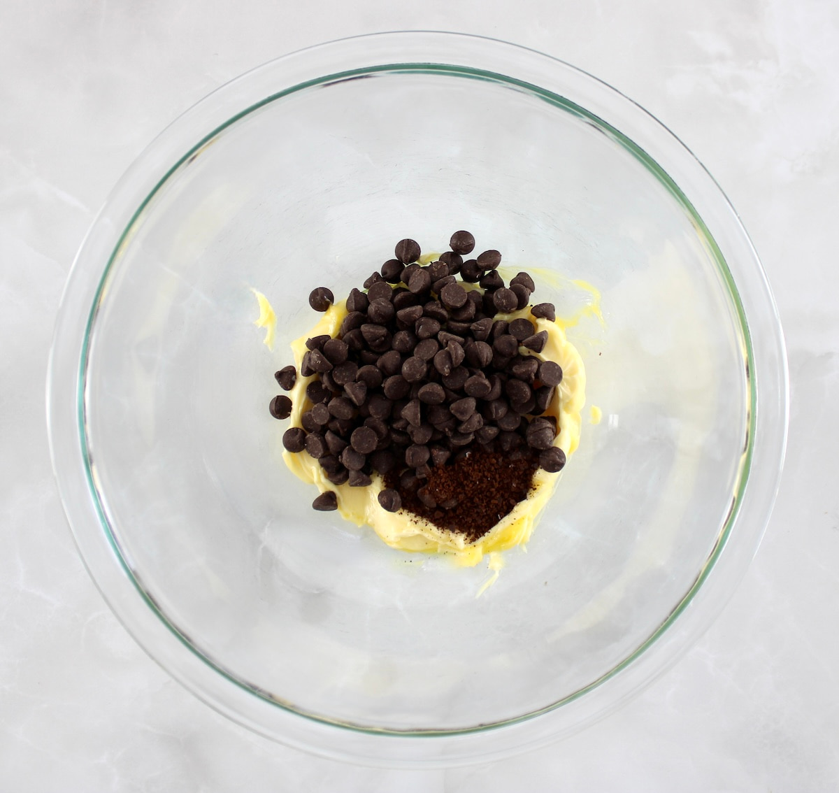 butter and chocolate chips in glass bowl
