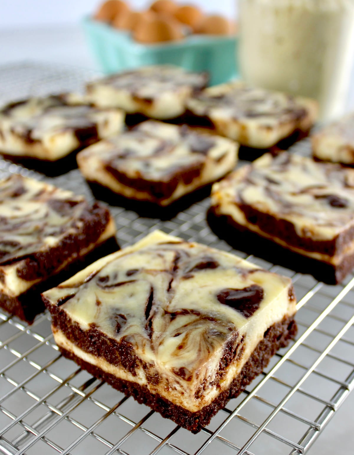 closeup of Keto Cheesecake Brownie Bars on cooling rack