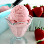 Strawberry Cottage Cheese Ice Cream in glass with strawberries in back
