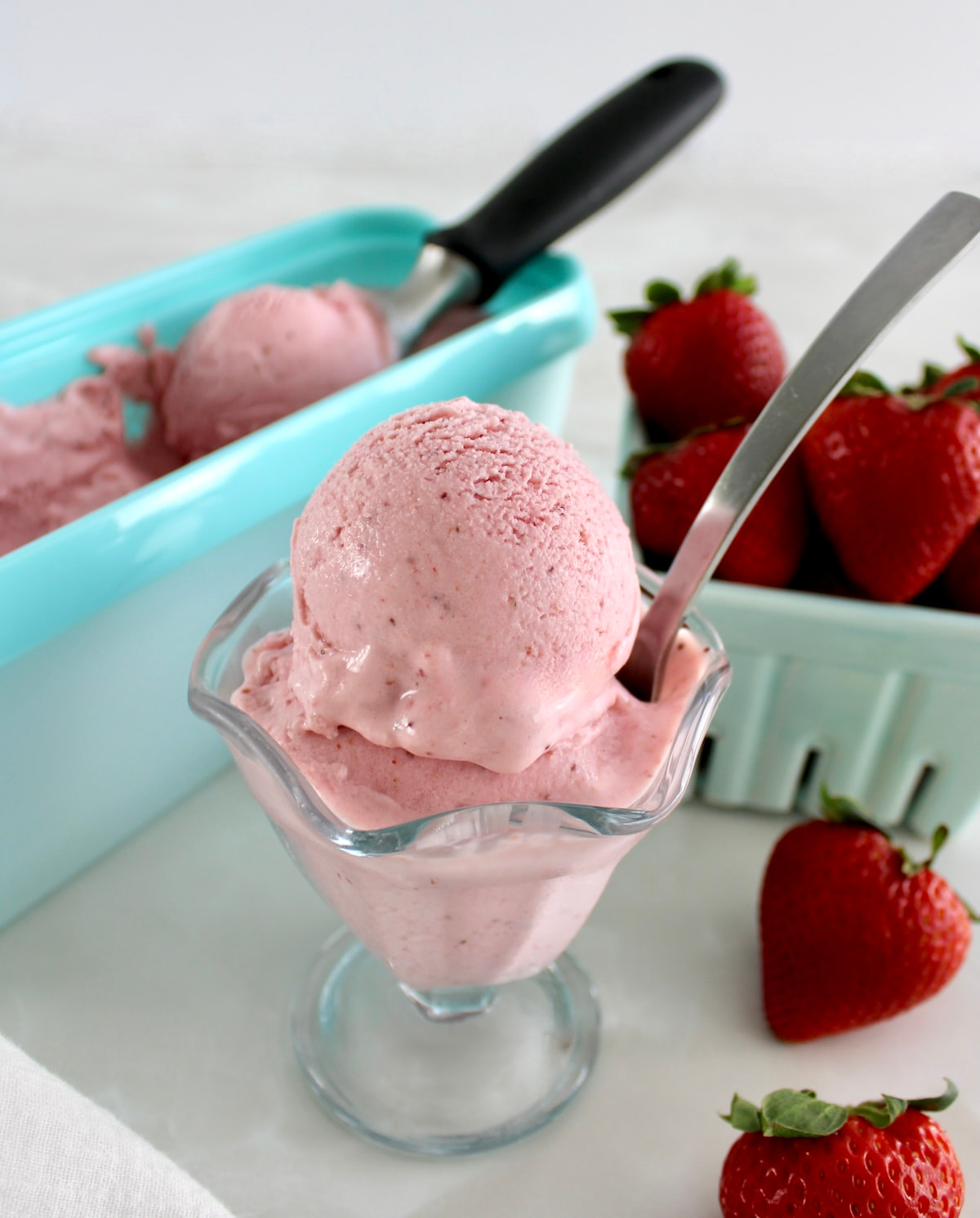 Strawberry Cottage Cheese Ice Cream in glass with spoon sticking out