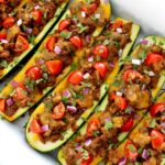 Taco Zucchini Boats in white casserole baking dish