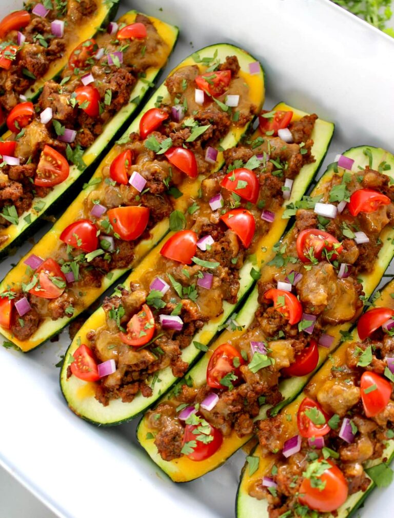 Taco Zucchini Boats in white casserole baking dish