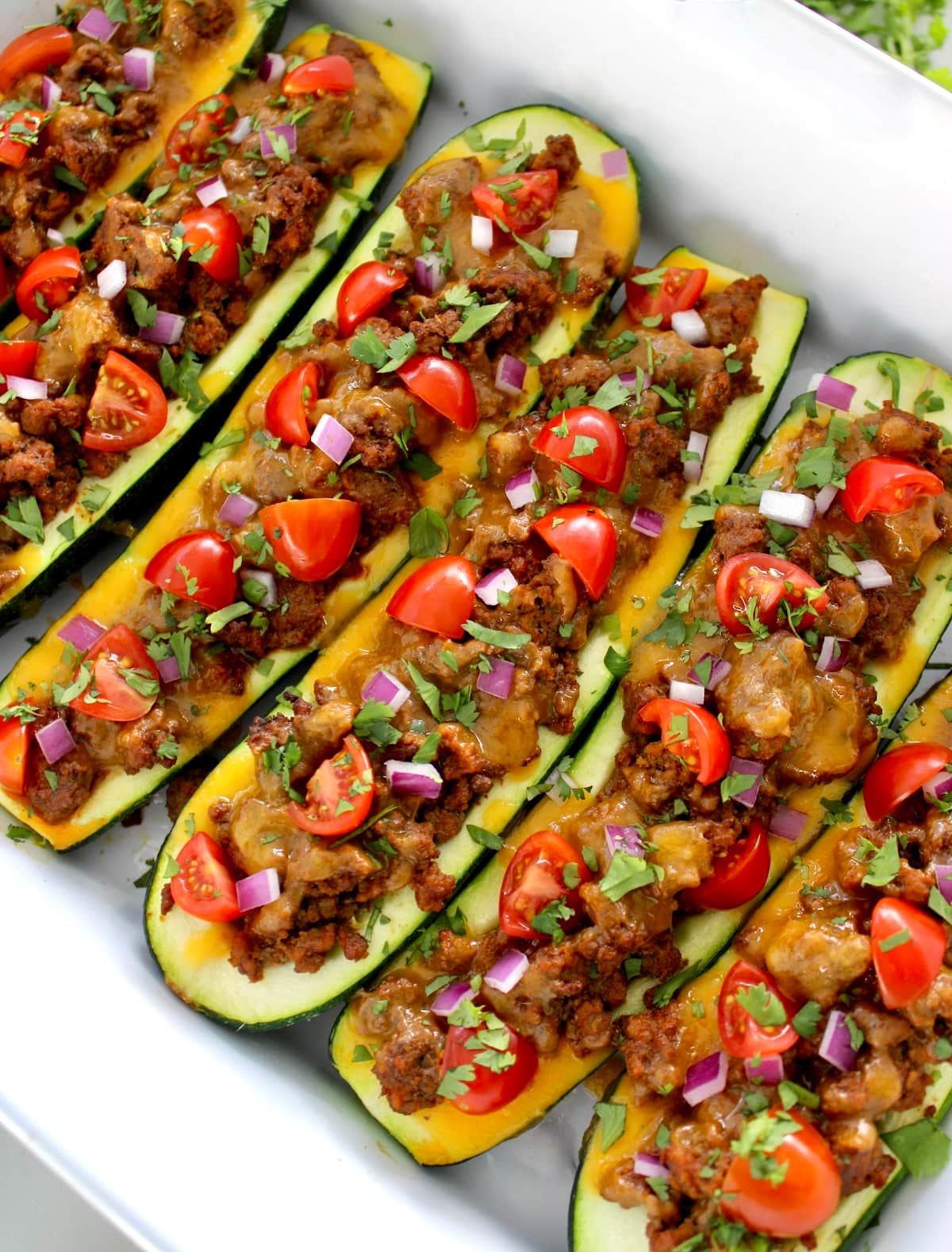 Taco Zucchini Boats in white casserole baking dish