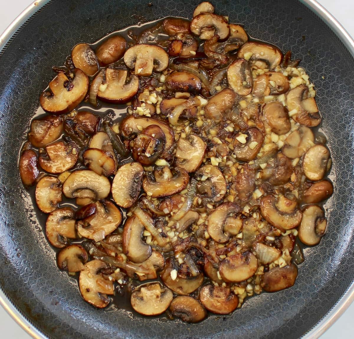 saut&eacute;ed mushrooms, onions and garlic in skillet with white wine