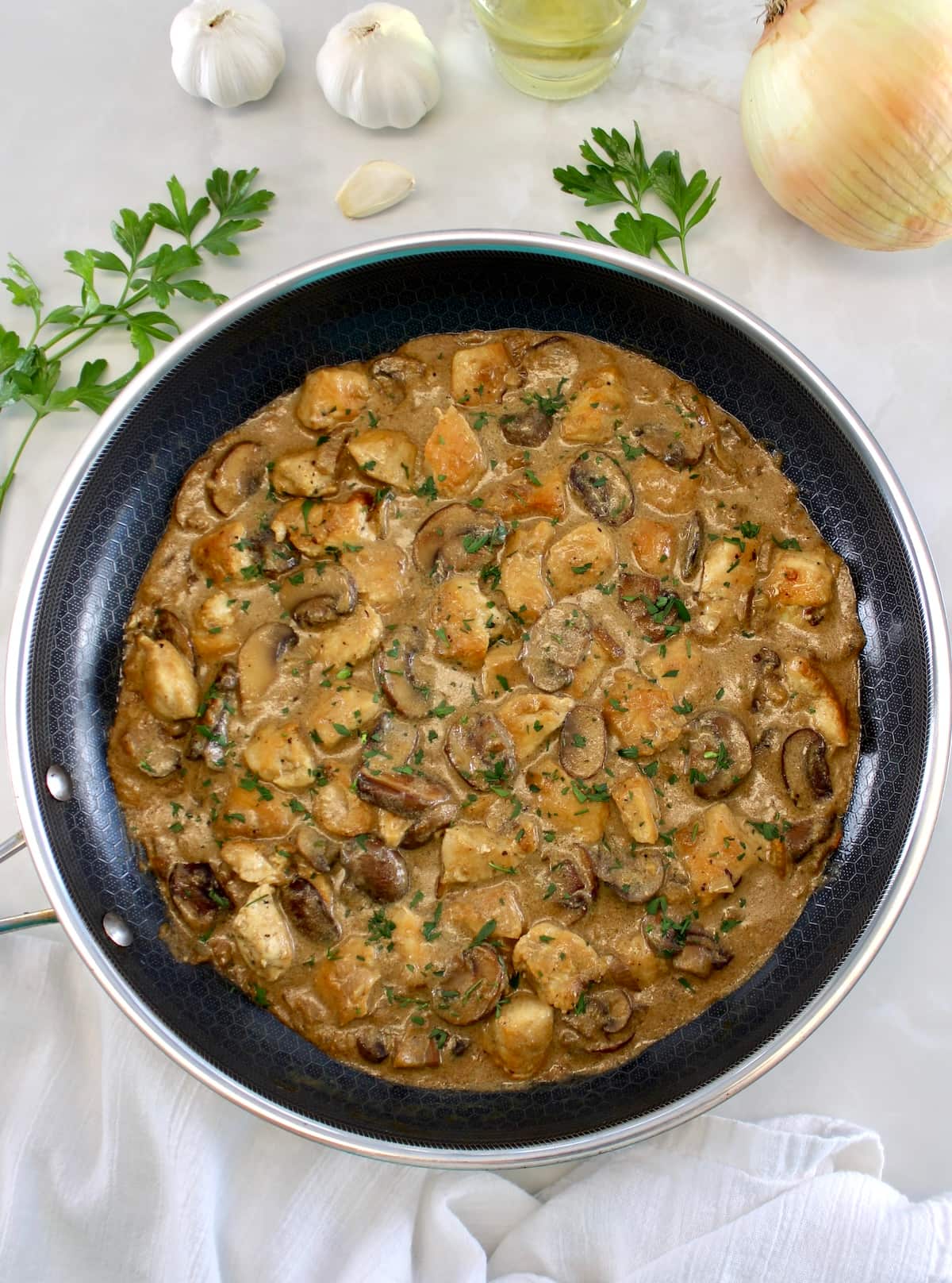overhead view of Chicken Stroganoff in skillet with chopped parsley