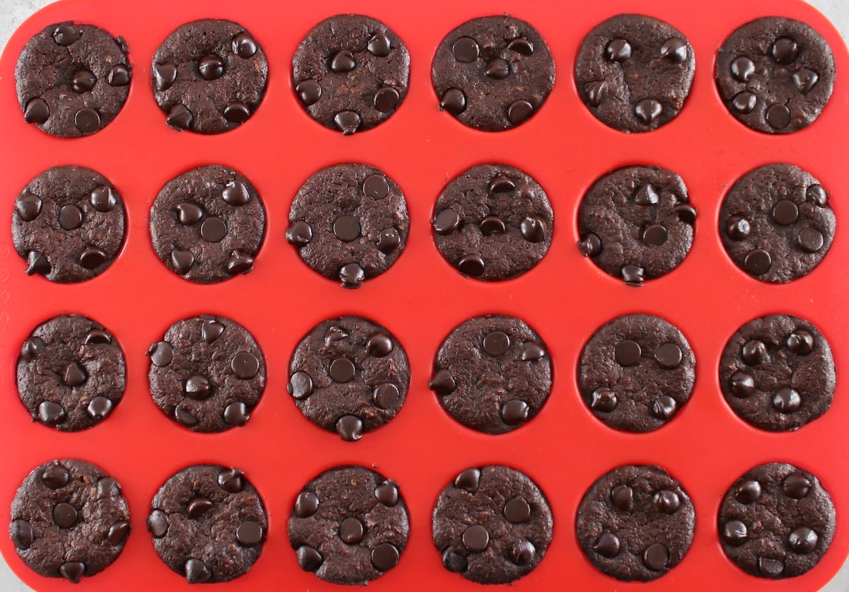 Chocolate Coconut Brownie Bites in red silicone mini muffin pan