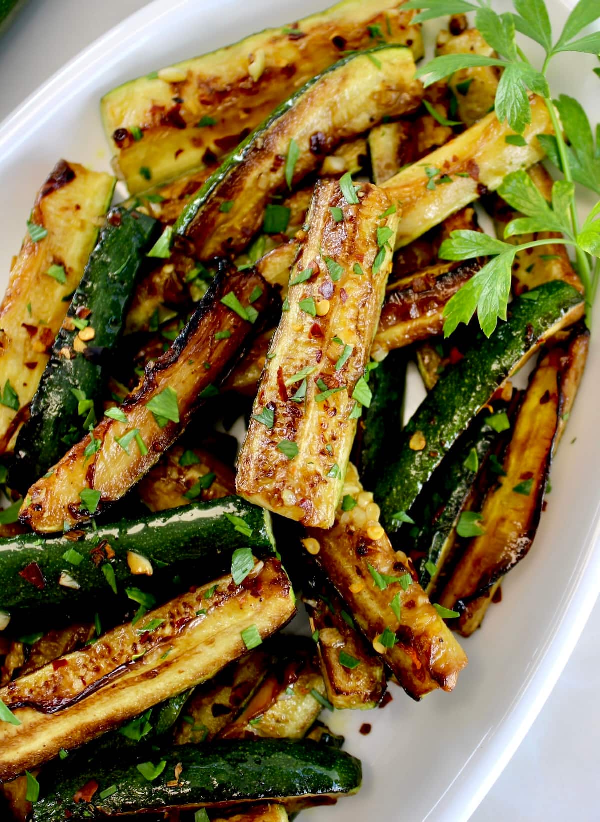 closeup of Easy Sautéed Zucchini on white plate