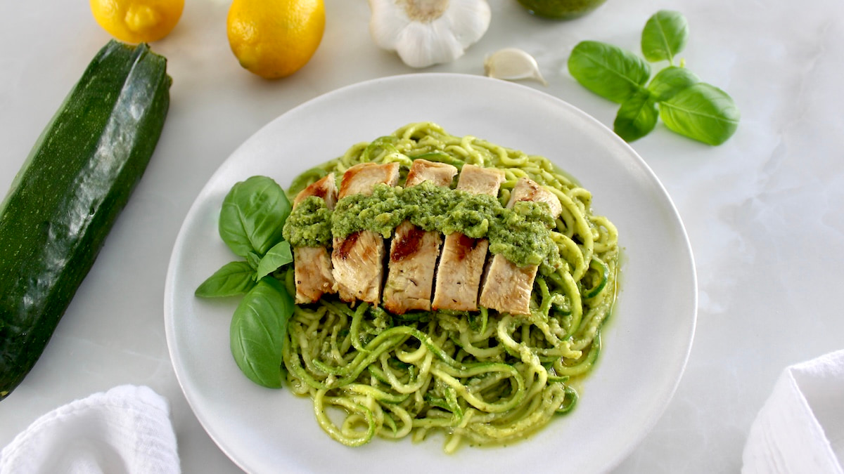 Grilled Lemon Chicken Pesto Zoodles with fresh basil garnish