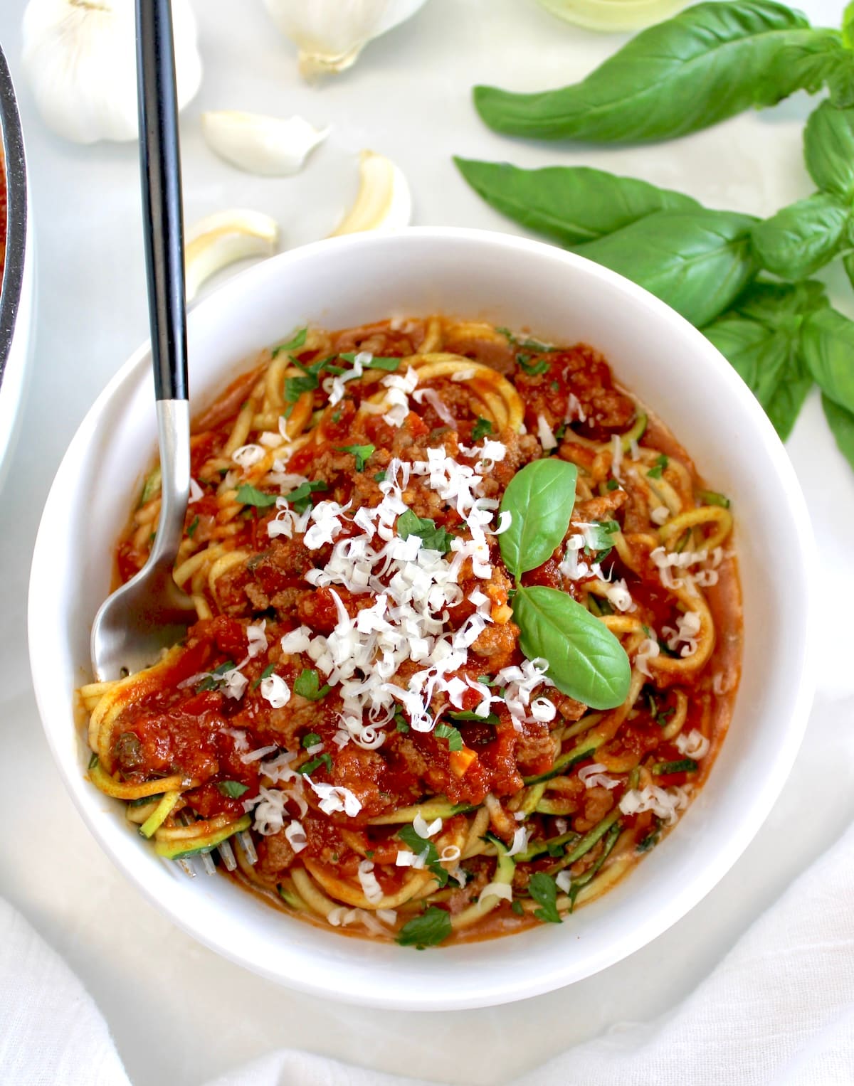 zucchini noodles with Italian Meat Sauce with forkful on side