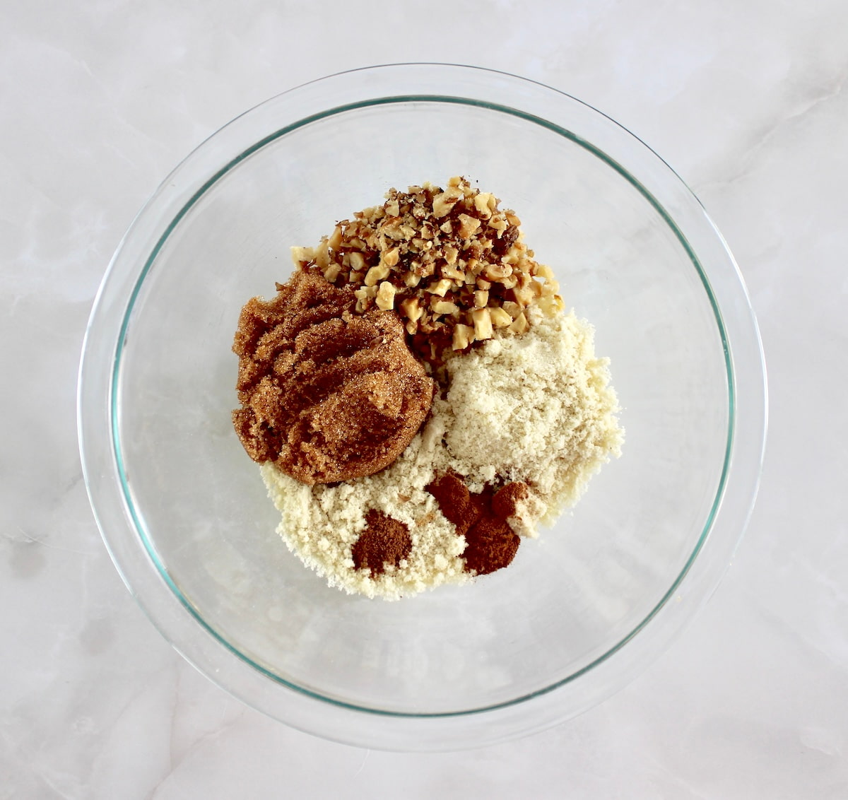 Keto Blueberry Crumb topping dry ingredients in glass bowl unmixed