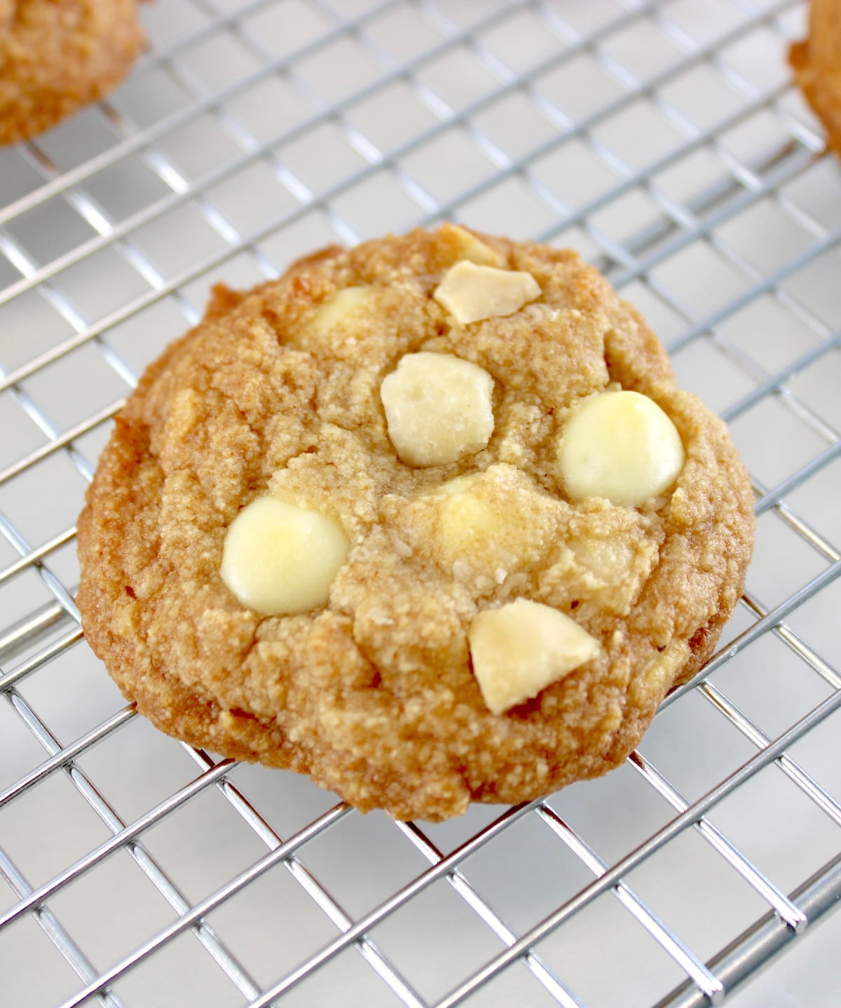 Keto White Chocolate Macadamia Nut Cookie on cooling rack