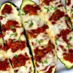Lasagna Stuffed Zucchini Boats in white casserole