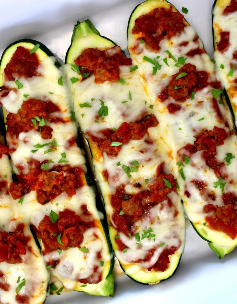 Lasagna Stuffed Zucchini Boats in white casserole