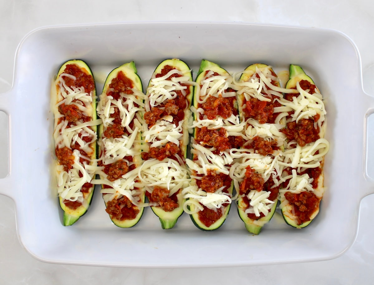 6 Lasagna Stuffed Zucchini Boats unbaked in white casserole