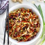 overhead view of Keto Egg Roll in a Bowl in white bowl with black chopsticks on side
