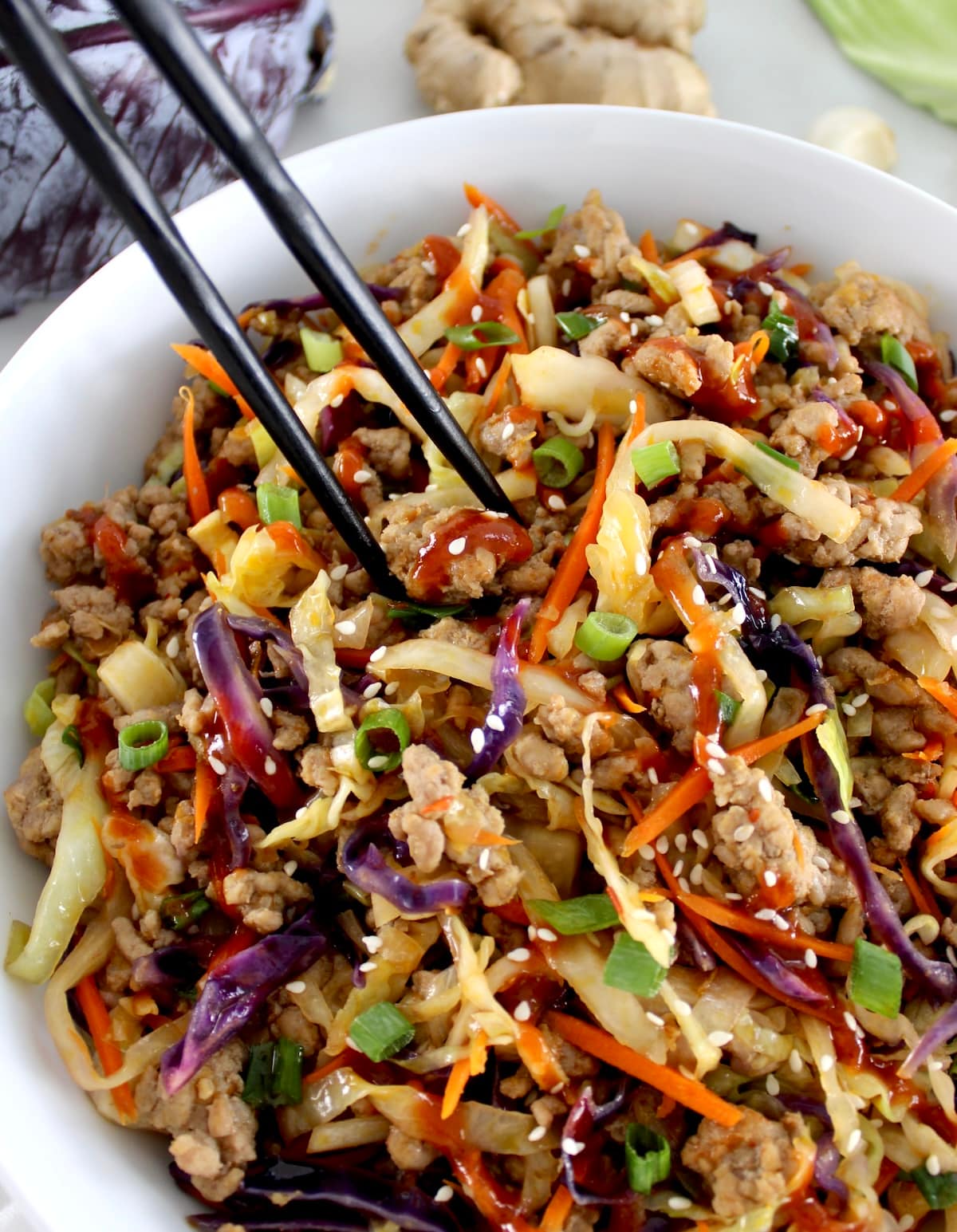 closeup of Keto Egg Roll in a Bowl in white bowl with black chopsticks