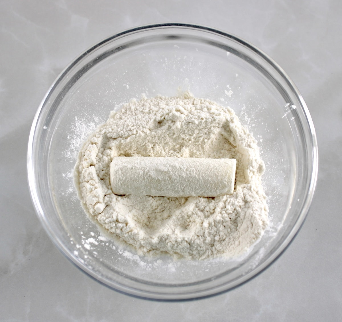 mozzarella stick in glass bowl with oat fiber