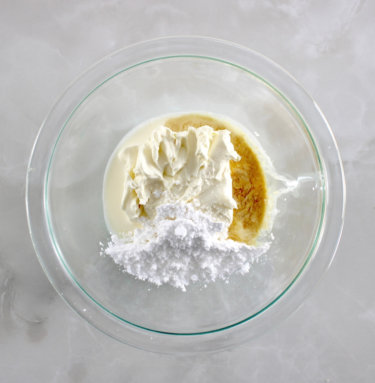 cream cheese filling ingredients in glass bowl unmixed