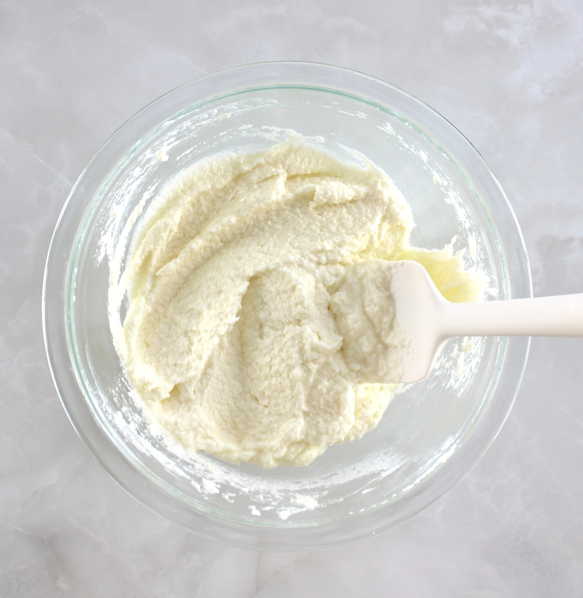 Keto Tiramisu Pancakes filling in glass bowl with white spatula