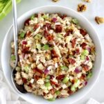 Bacon Honey Mustard Chicken Salad in white bowl with silver serving spoon on side