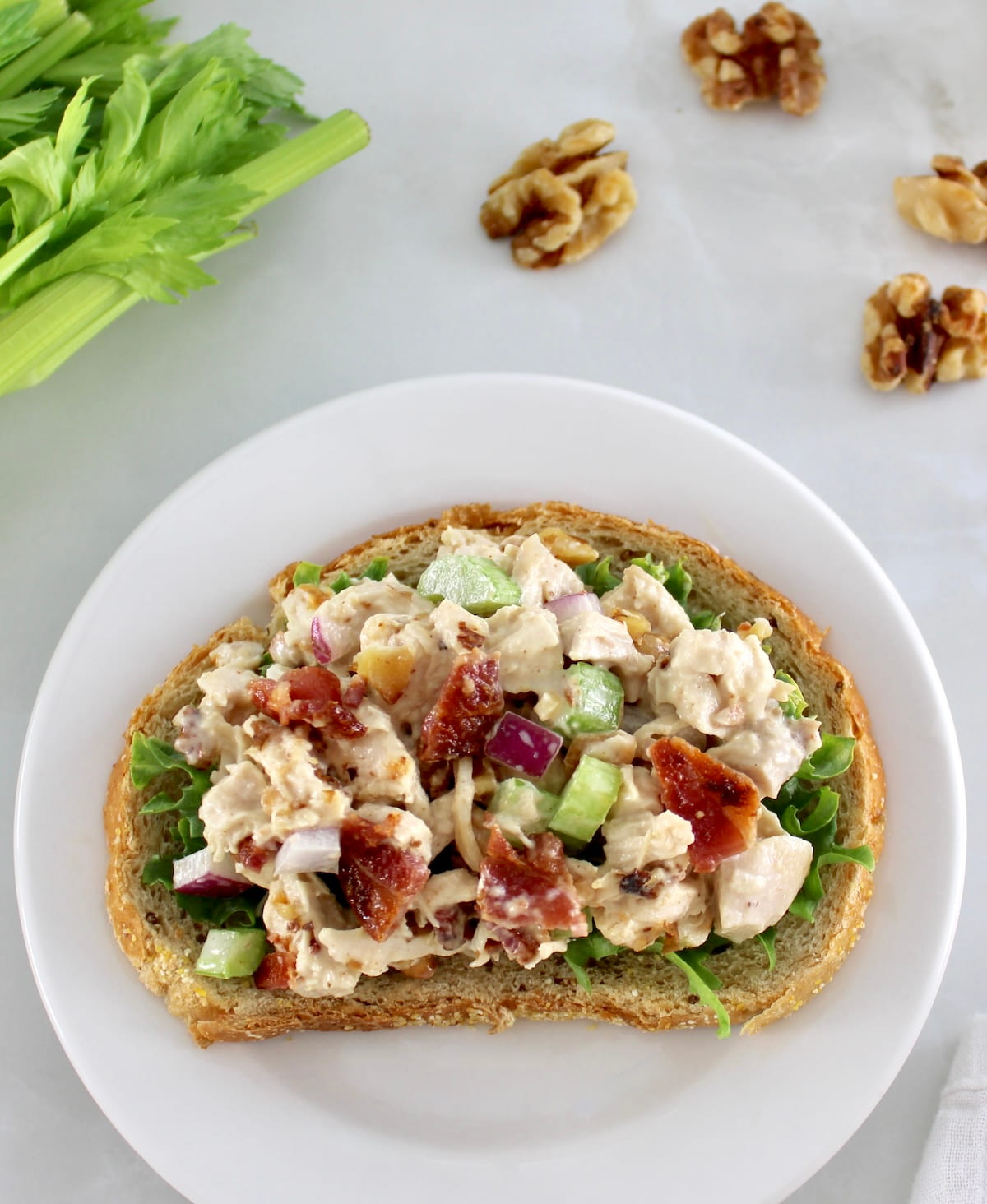 Bacon Honey Mustard Chicken Salad on slice of keto bread on white plate