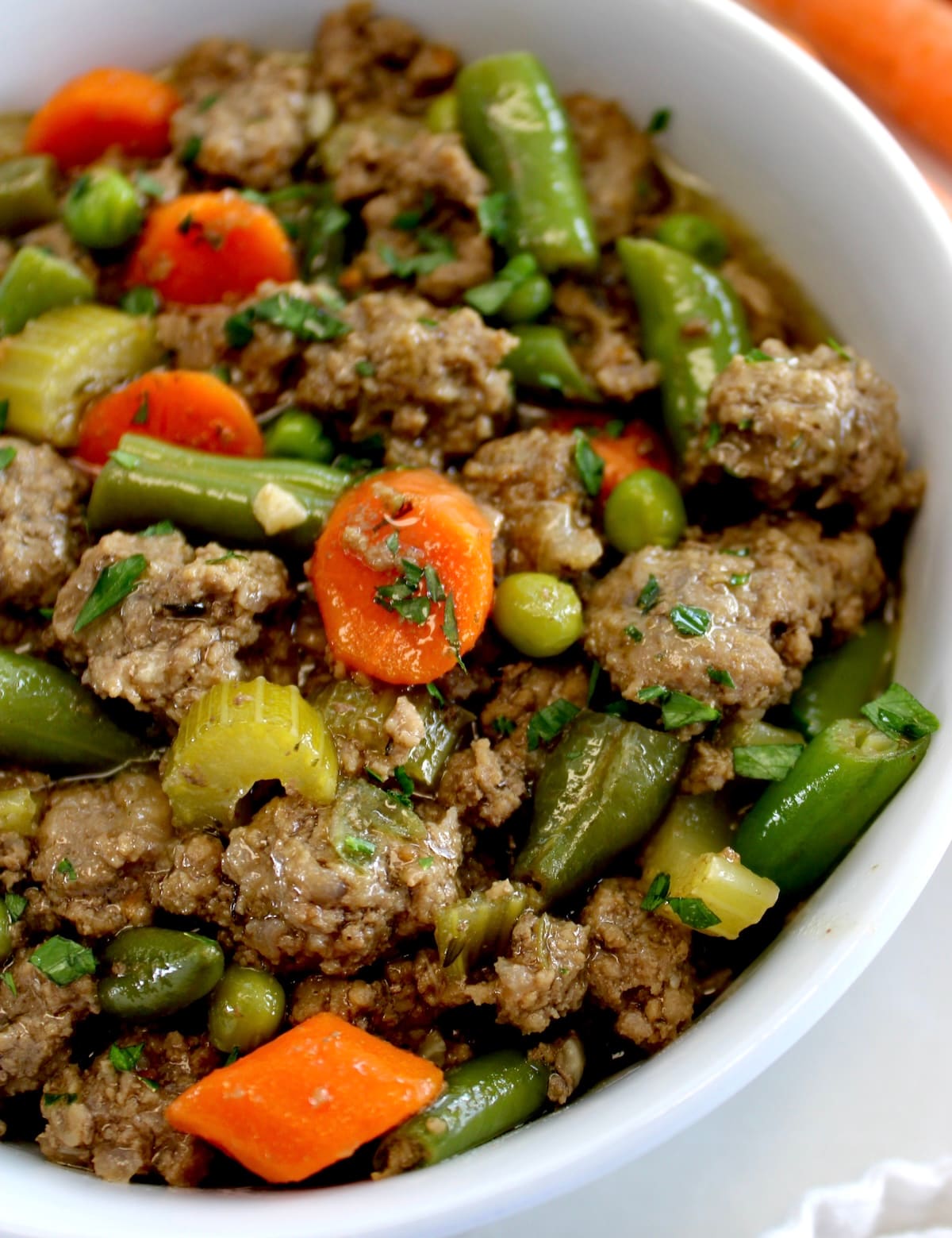 closeup of Ground Beef Stew in white bowl