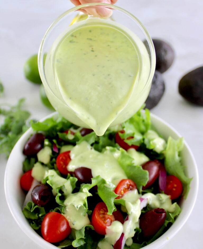 Keto Avocado Ranch Dressing being poured over salad