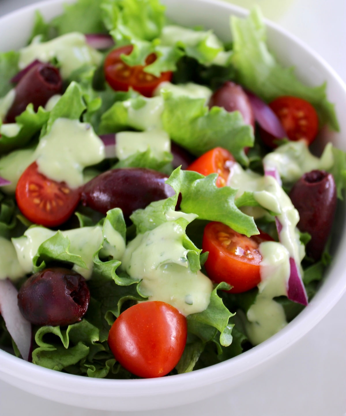 closeup of salad with Keto Avocado Ranch Dressing on top