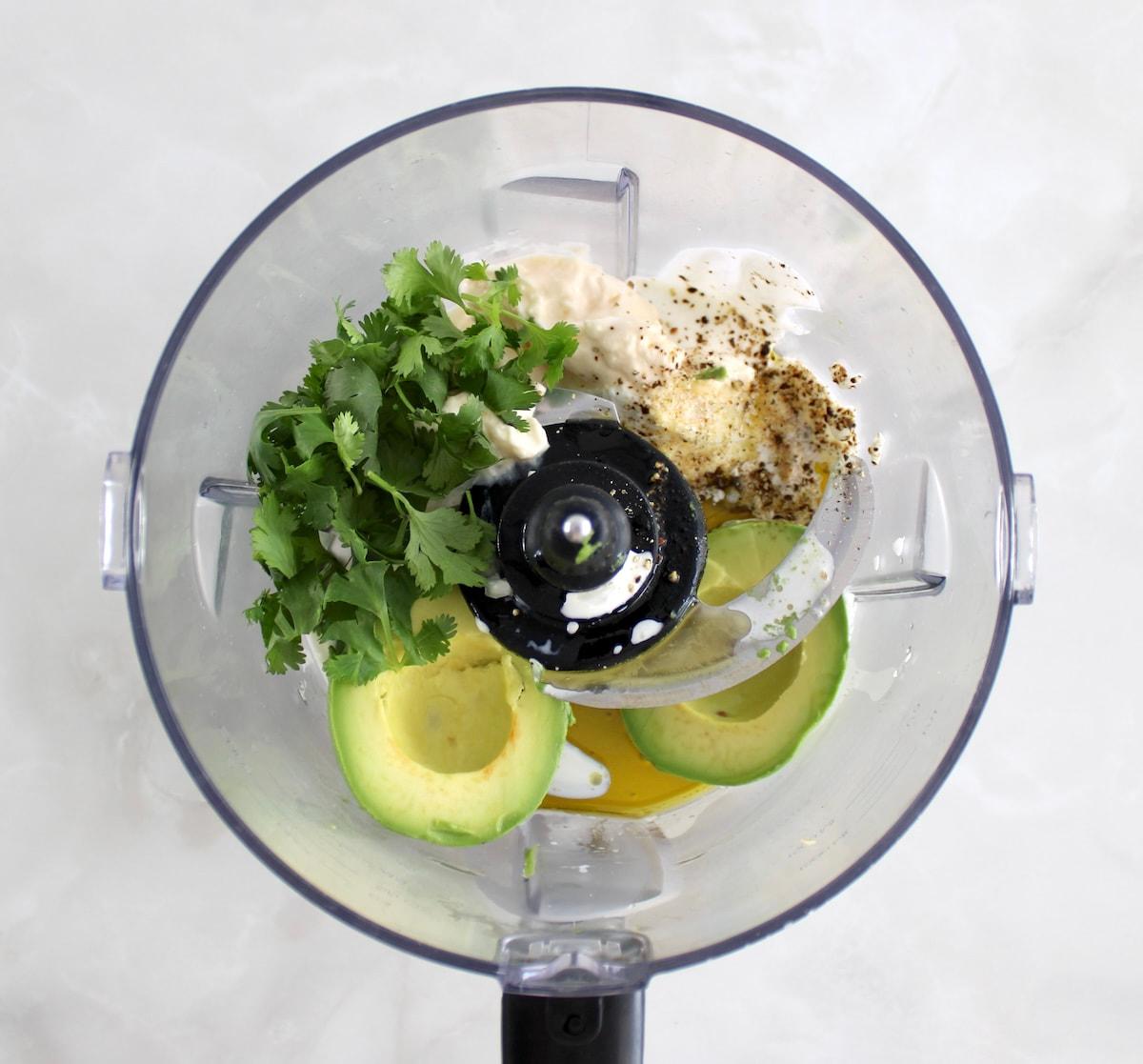 Keto Avocado Ranch Dressing ingredients in food processor unmixed