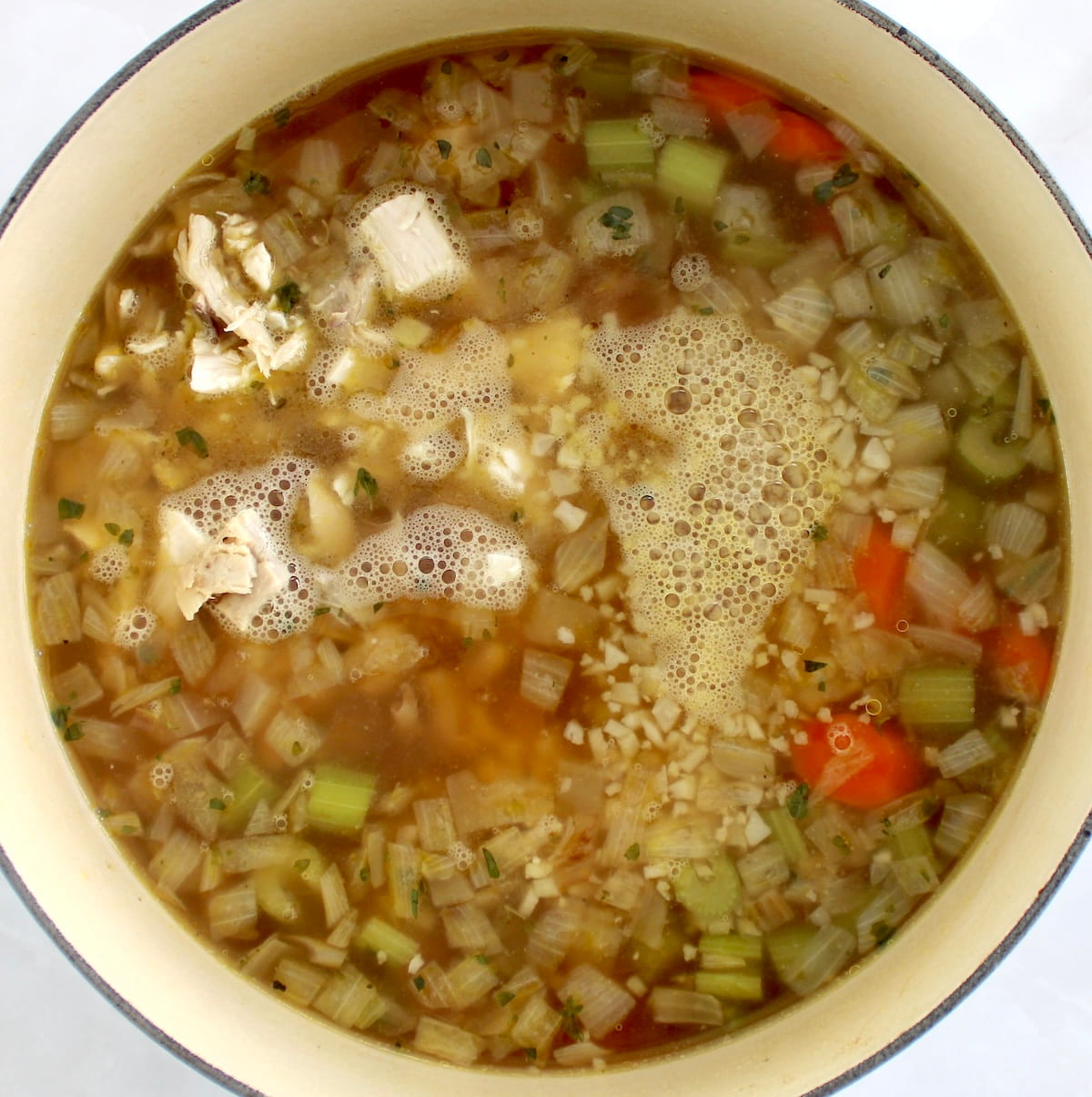 Keto Chicken Soup with Cauliflower Rice in pot cooking