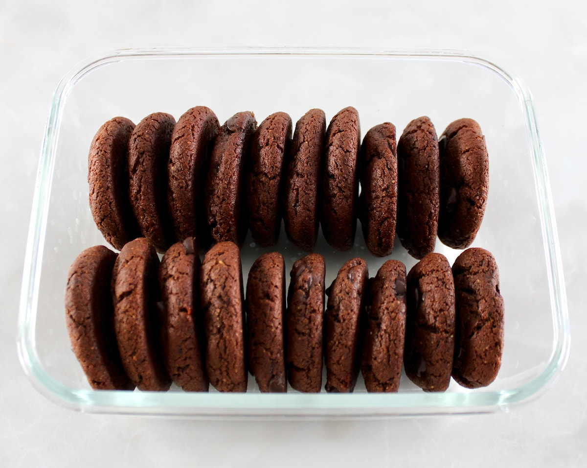 20 Keto Chocolate Almond Butter Cookies in glass storage container