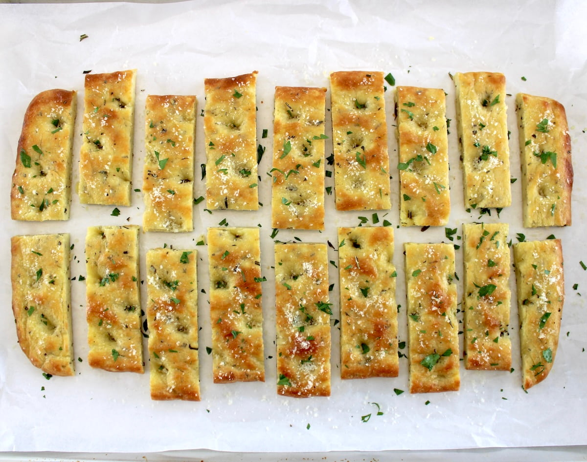 18 Keto Focaccia Breadsticks on parchment paper