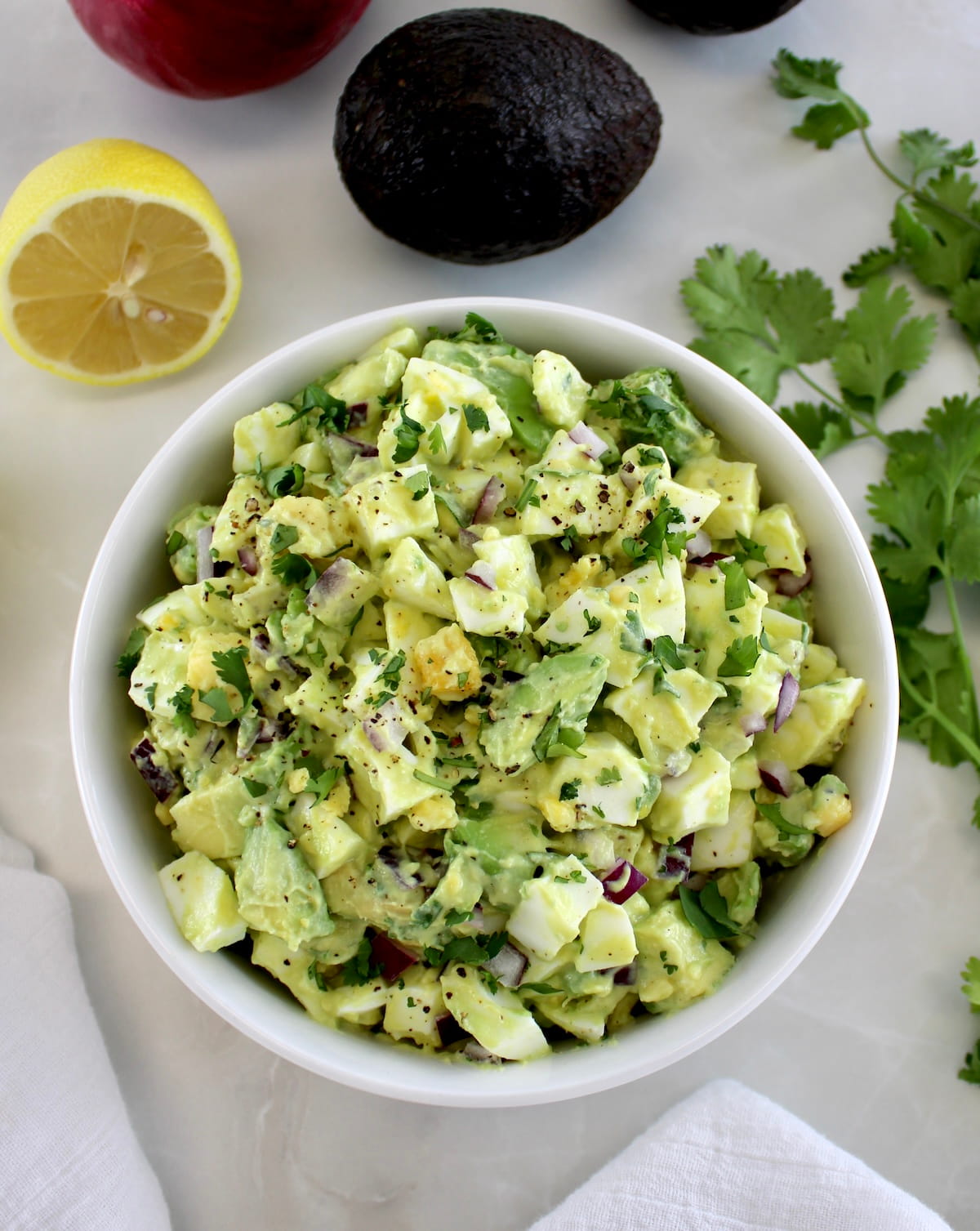 overhead view of Avocado Egg Salad in white bowl
