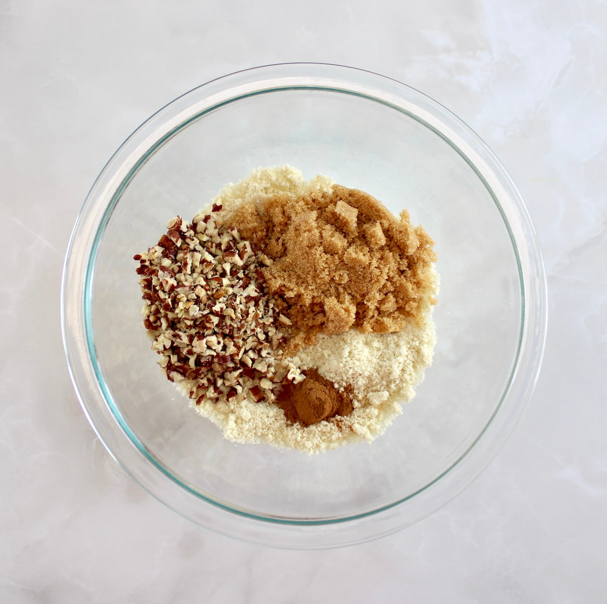 Keto Blackberry Crumble topping ingredients in glass bowl unmixed