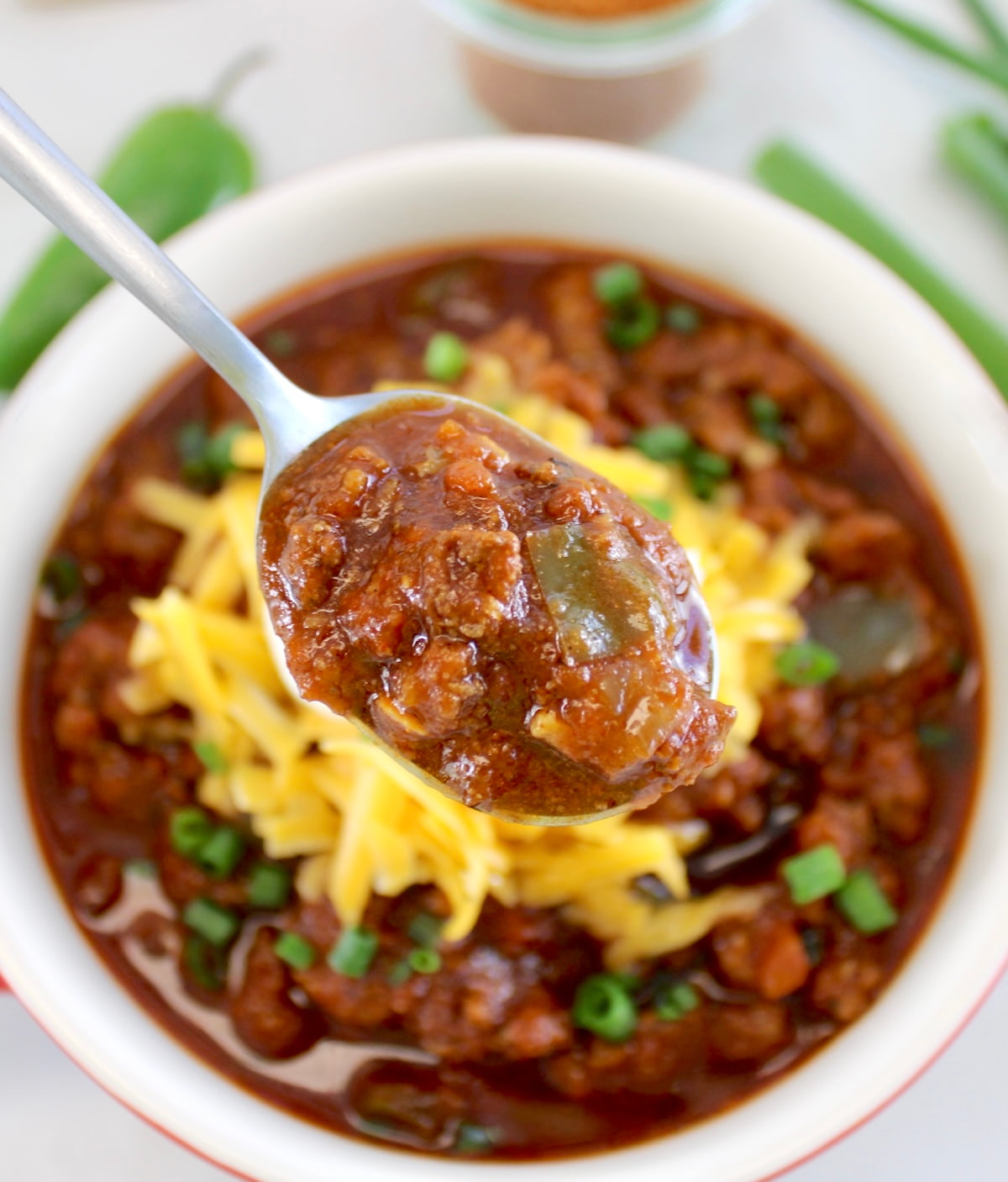 holding up spoonful of Keto Instant Pot No-Bean Chili