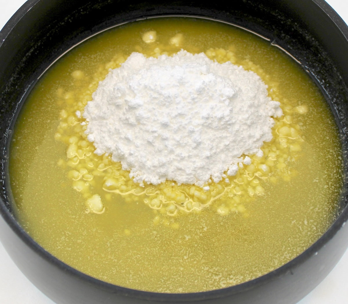 melted butter in saucepan with sweetener on top