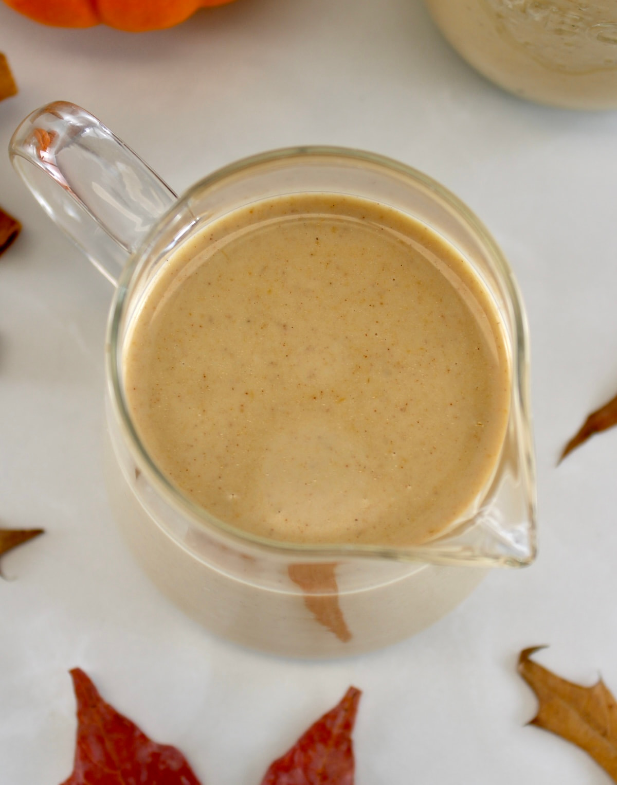 overhead view of Keto Pumpkin Spice Coffee Creamer in glass pitcher